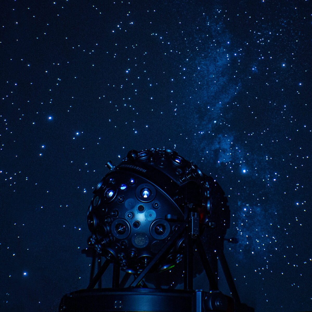 The Zeiss projector against a projected starry night