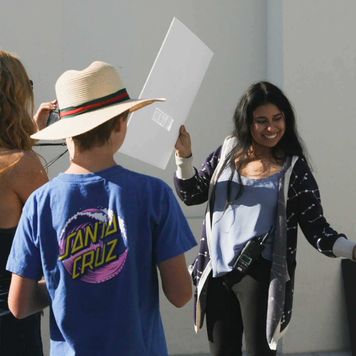 Astronomical Observer Vanessa Alarcon demonstrating solar eclipse shadows on poster board.