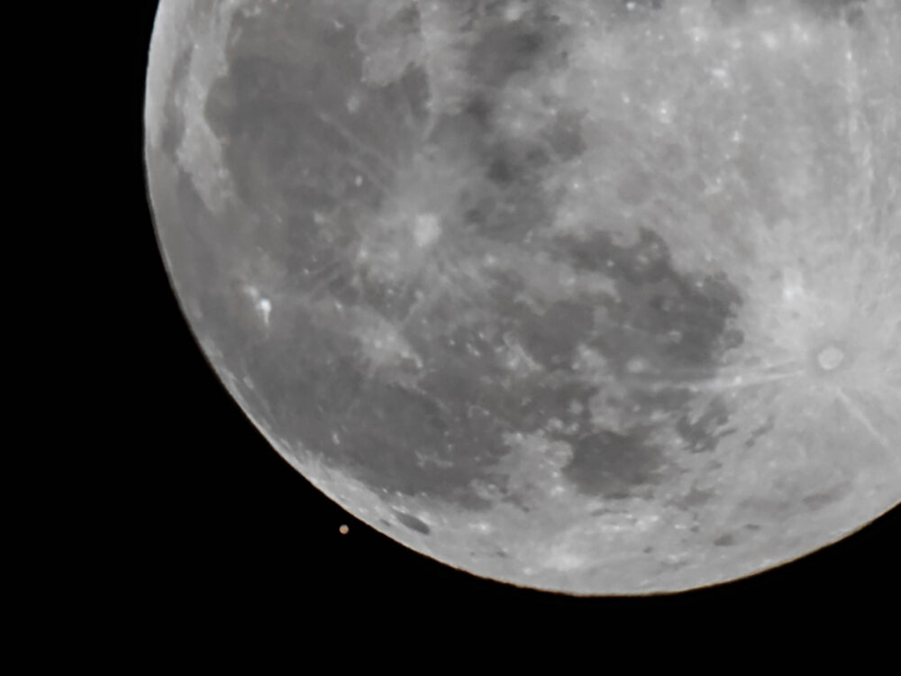 Closeup of Mars being almost overtaken by the Moon.