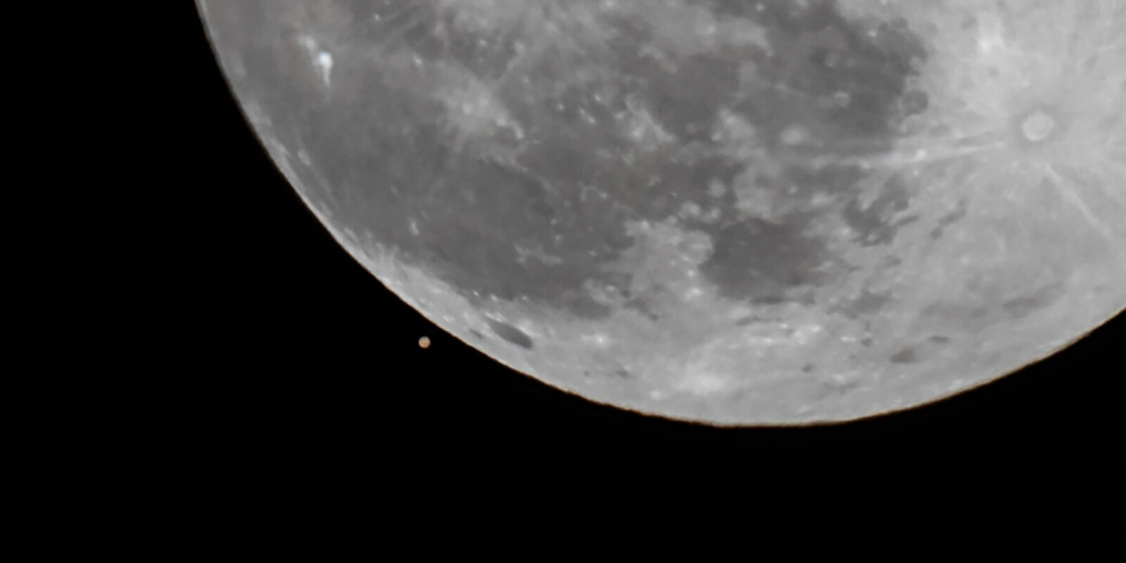 Closeup of Mars being almost overtaken by the Moon.