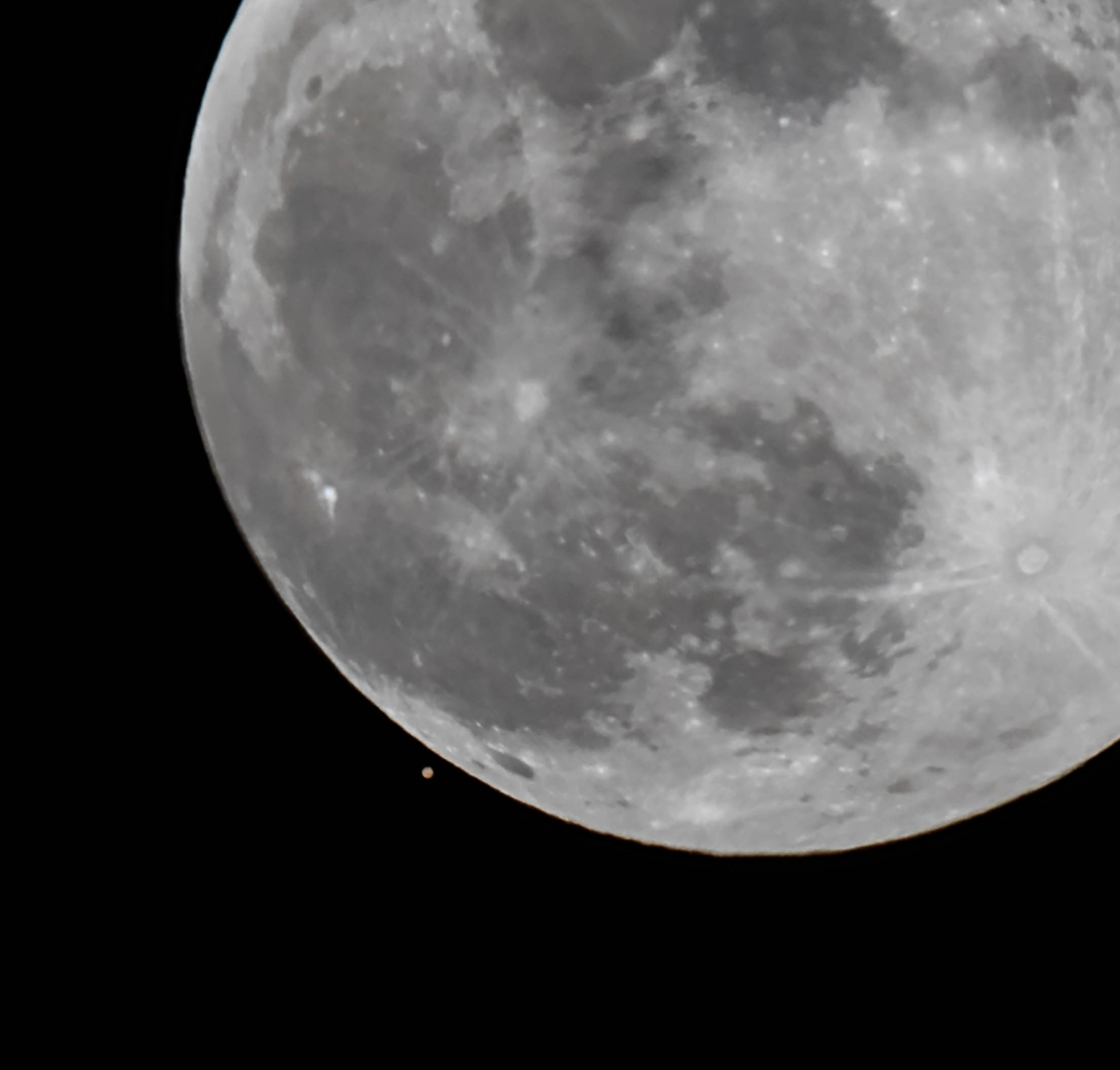 Closeup of Mars being almost overtaken by the Moon.