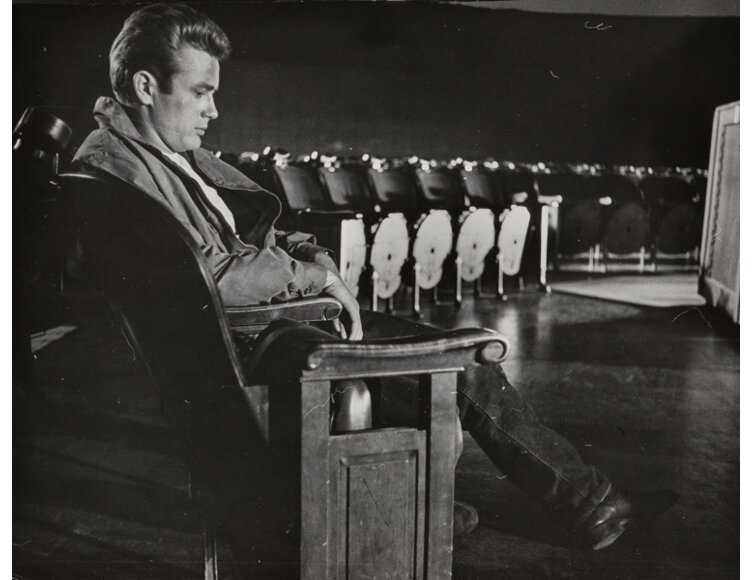 James Dean sitting in the planetarium.