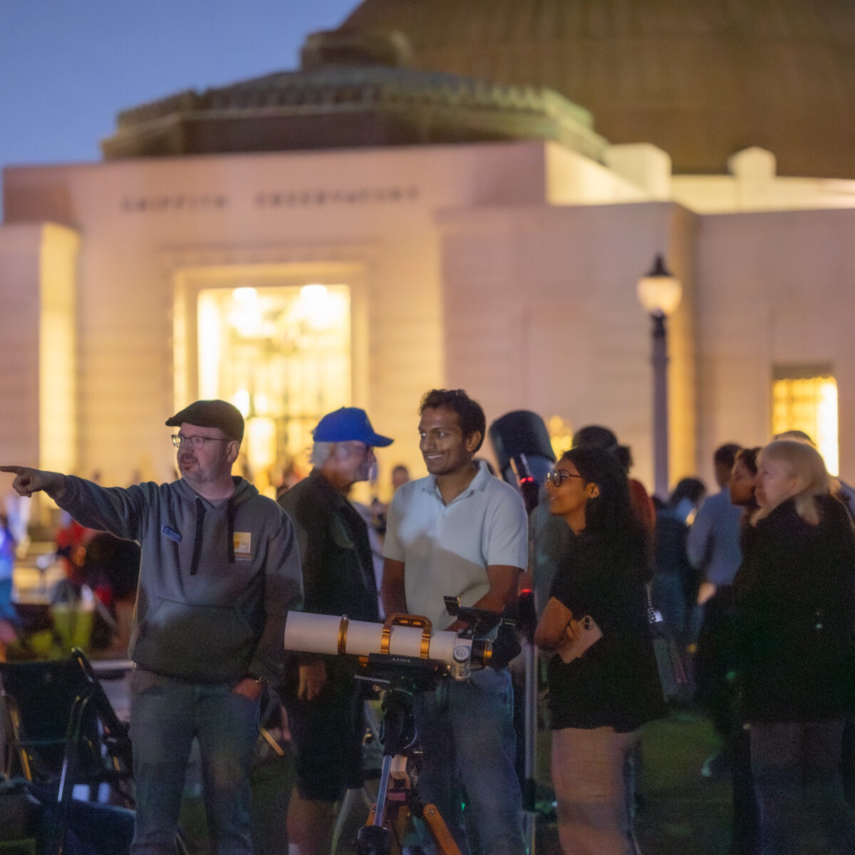 People gathered on the lawn for a star party.