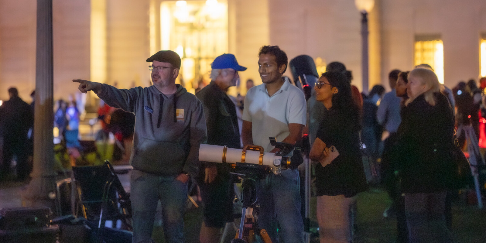 People gathered on the lawn for a star party.