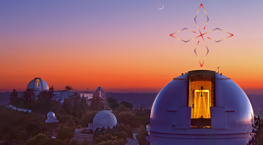 At twilight, two domes reach above a mountain, with a crescent moon above. Dome lights illuminate the Lick Observatory telescopes.