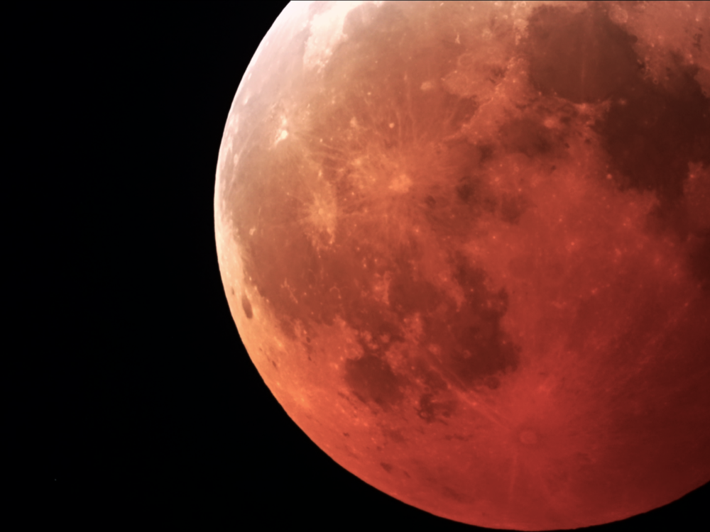 A mid-shot of the Moon at total eclipse, while it is at its reddest.